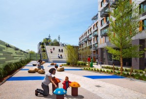 The enclosed courtyard at the ground level provides a place for children to play. (David Sundberg) 