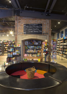 An old fireplace creates a focal point for Changing Hands' selection of toys and children's books. [Venue Projects, LLC]